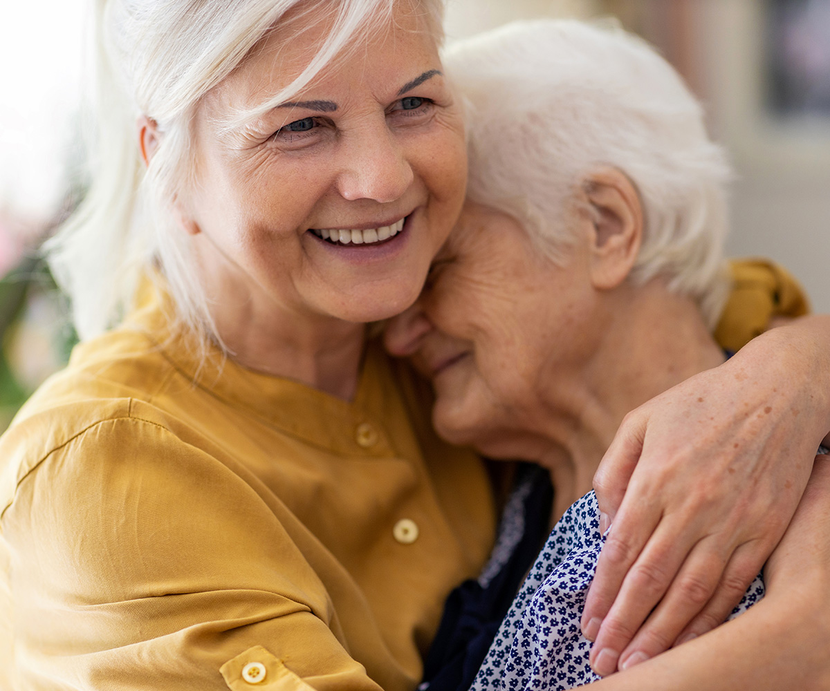 Woman and mother hugging